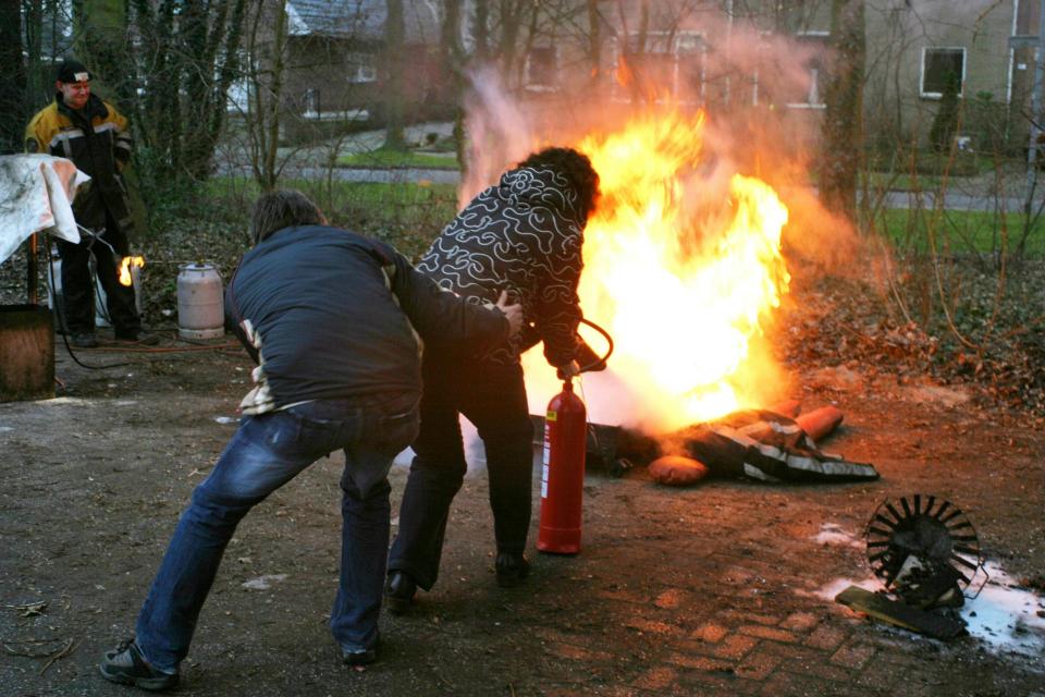 People trying to take out a fire