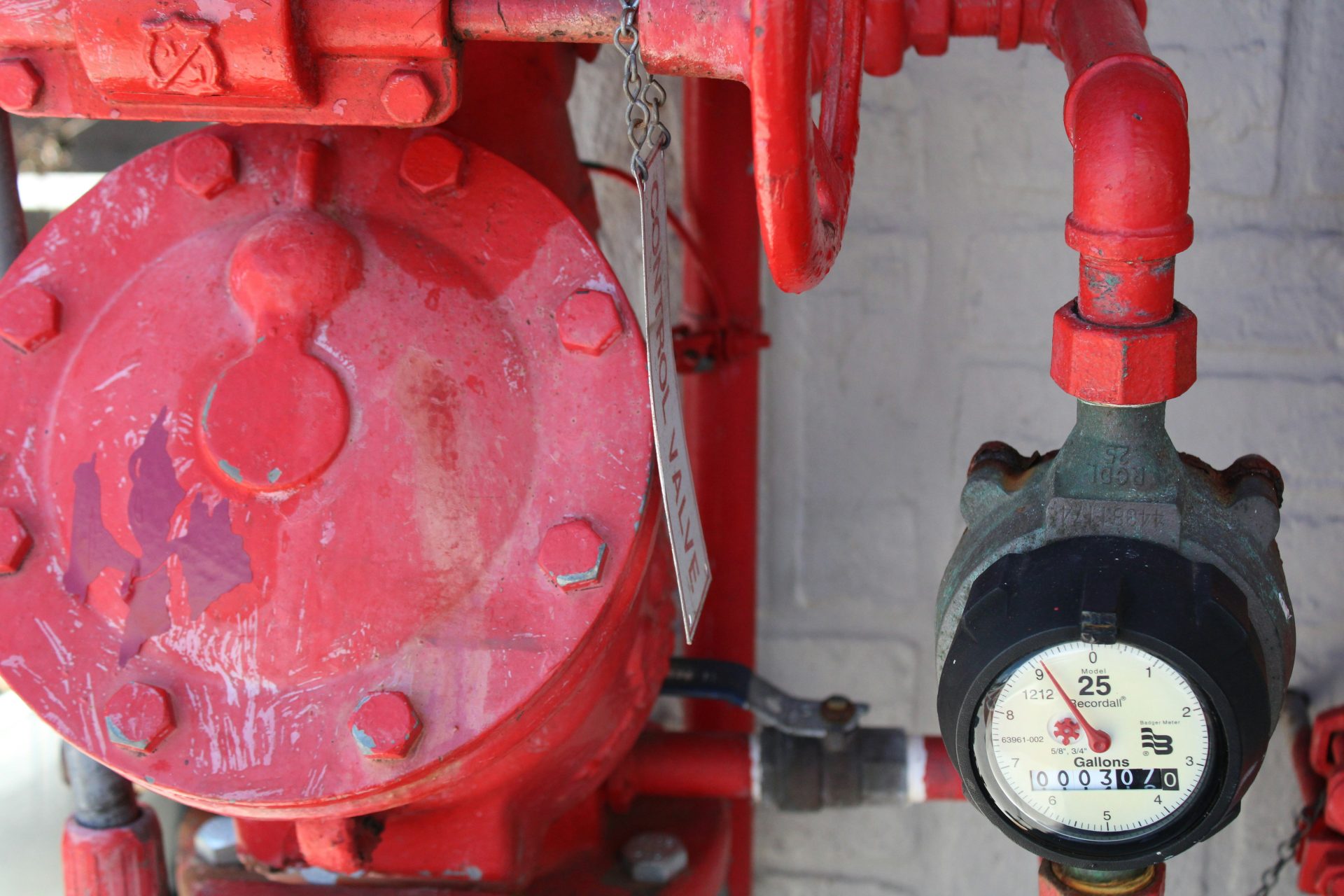 red fire hydrant and a water meter